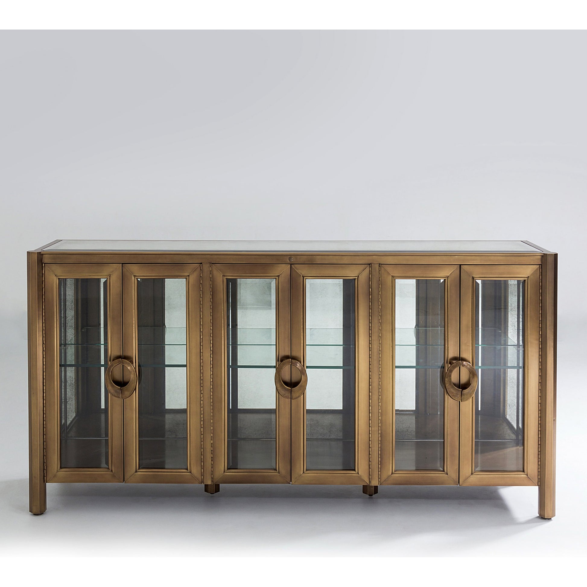 Apothecary Console Cabinet by Global Views in dark brass. Made from poplar, beveled clear glass in a transitional style.