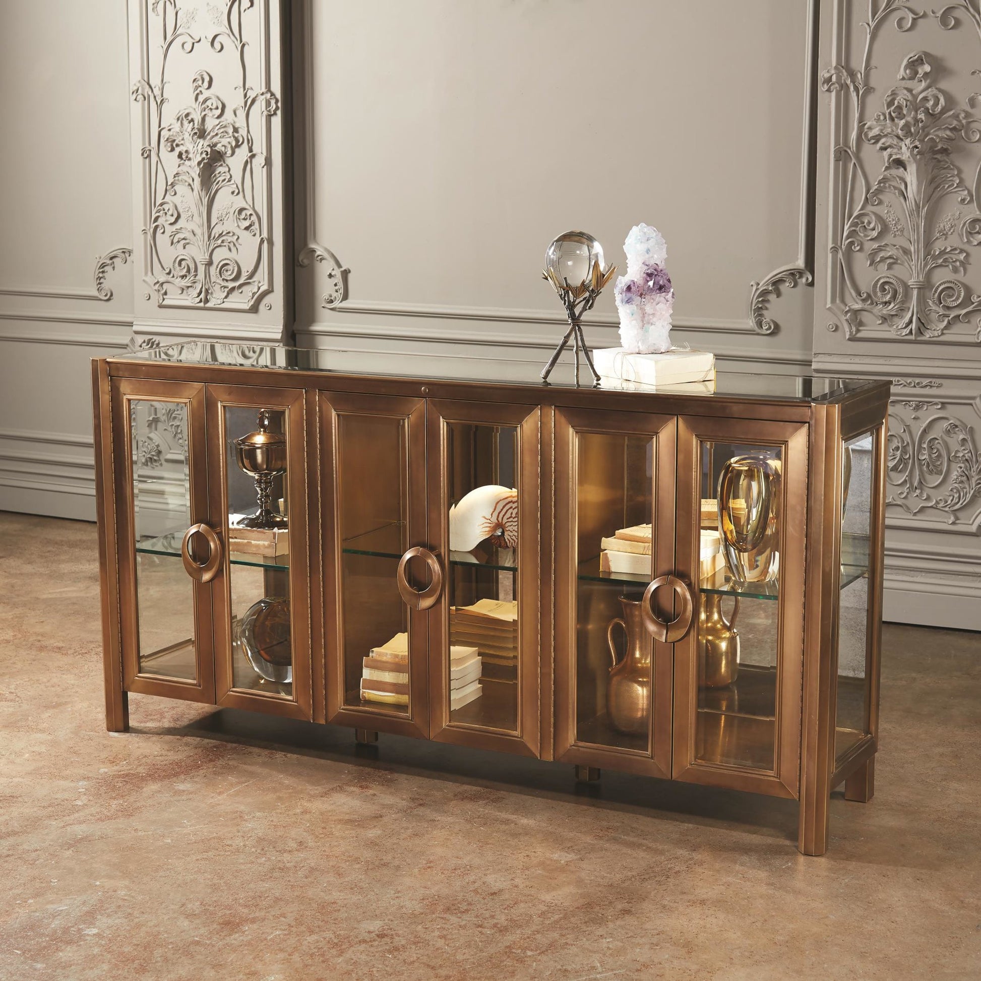 Apothecary Console Cabinet by Global Views in dark brass. Made from poplar, beveled clear glass in a transitional style.
