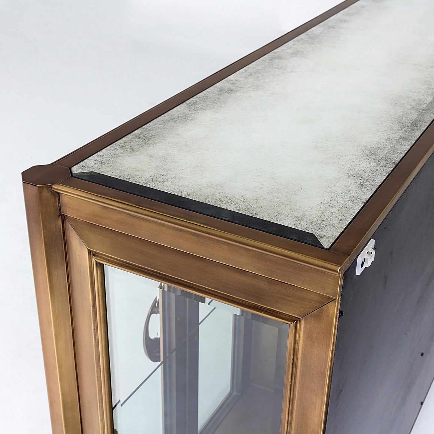 006 SR-700723 | Closeup | Apothecary Console Cabinet by Global Views in dark brass. Made from poplar, beveled clear glass in a transitional style.