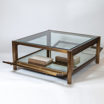 Apothecary Cocktail Table by Global Views in dark brass. Made from poplar, beveled glass in a transitional style.