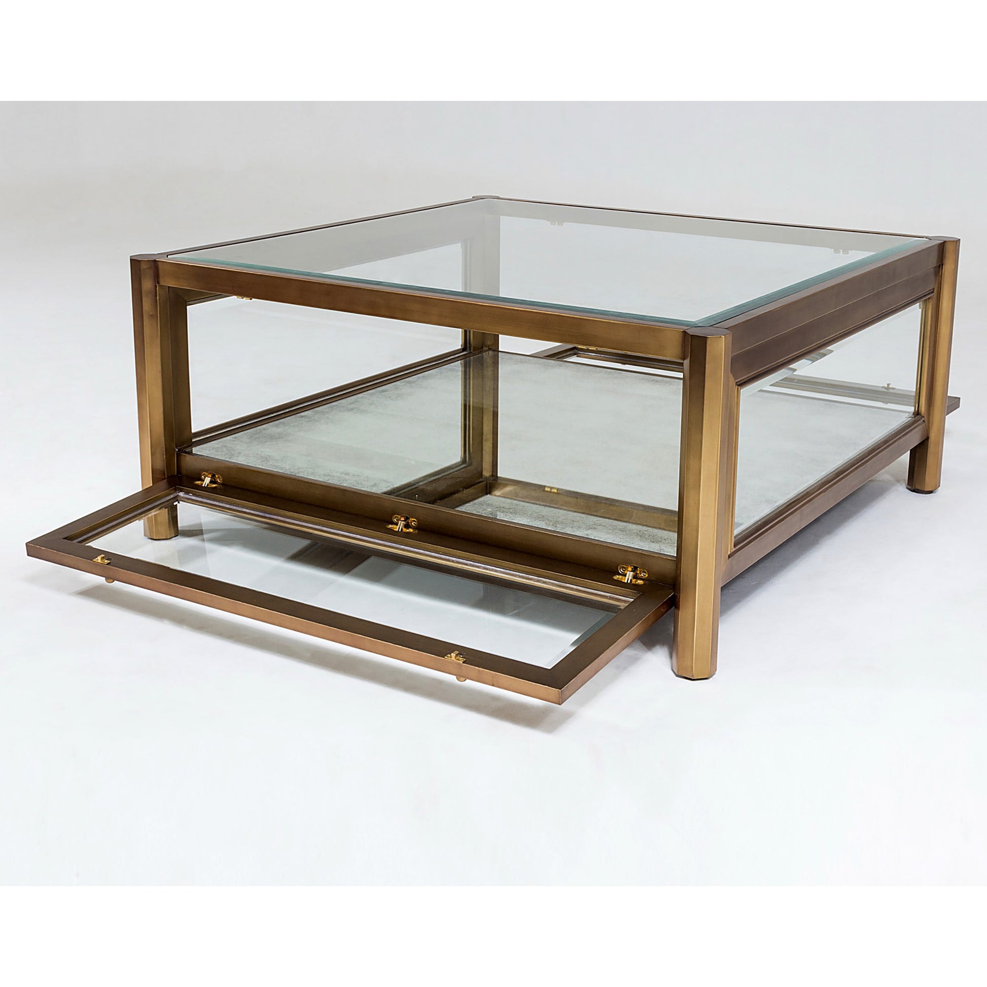 Apothecary Cocktail Table by Global Views in dark brass. Made from poplar, beveled glass in a transitional style.