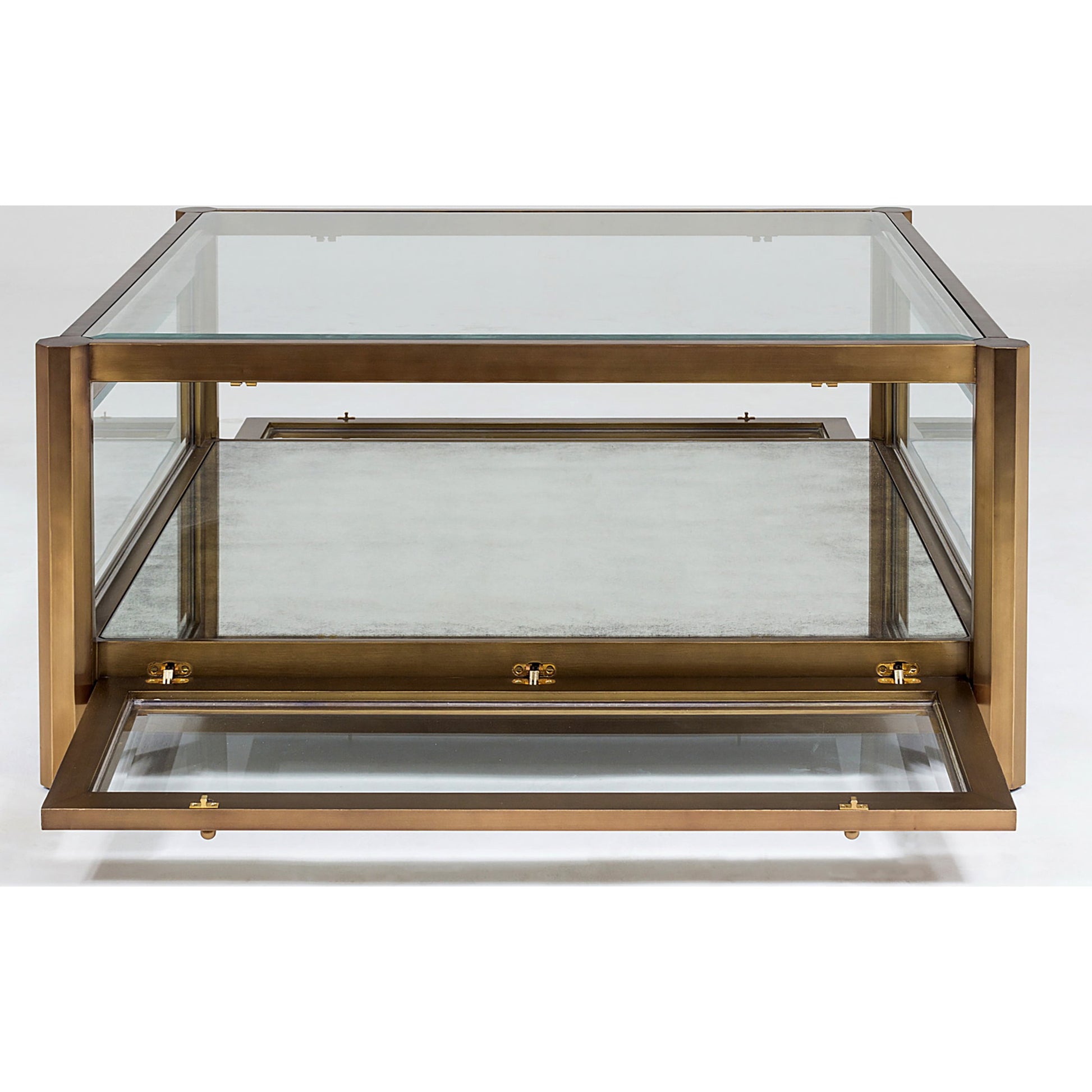 Apothecary Cocktail Table by Global Views in dark brass. Made from poplar, beveled glass in a transitional style.