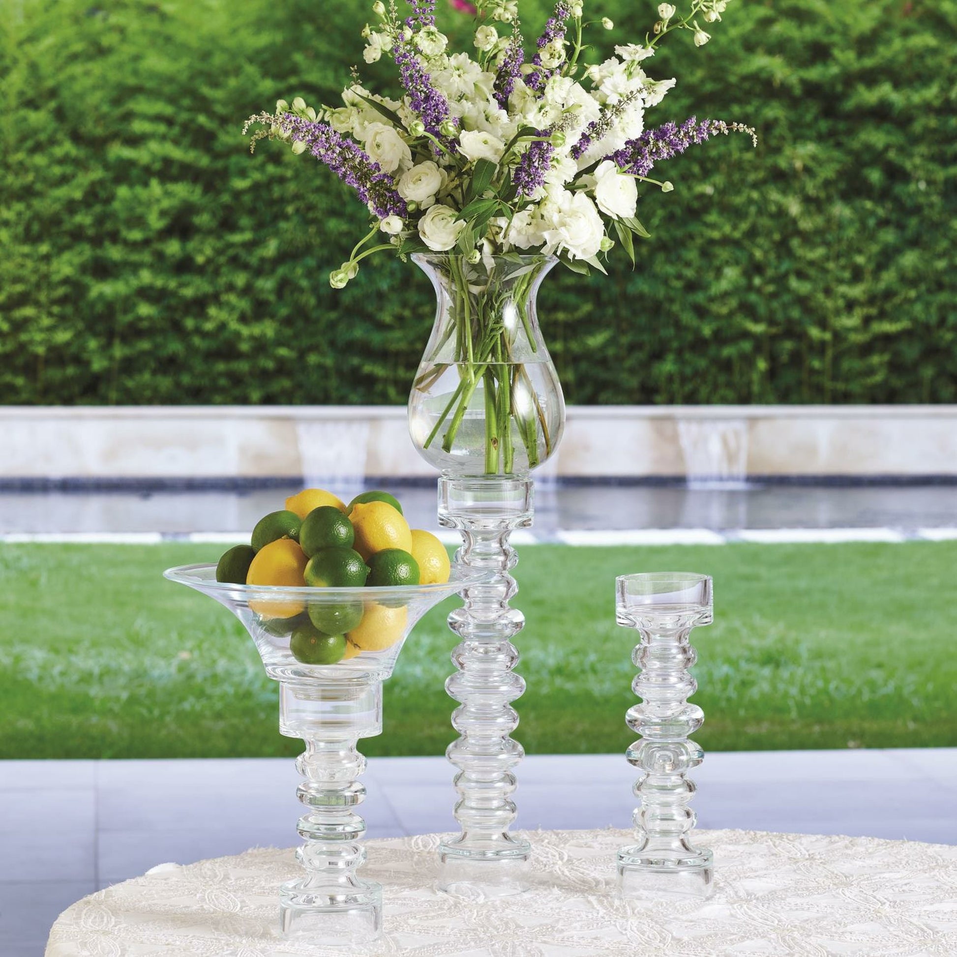 Glass Ribbed Candleholder by Global Views. Made from glass in a transitional style.