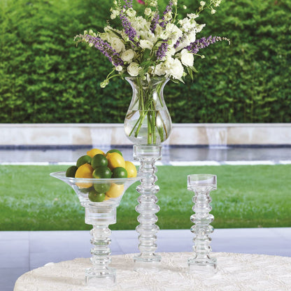 Glass Ribbed Candleholder by Global Views. Made from glass in a transitional style.