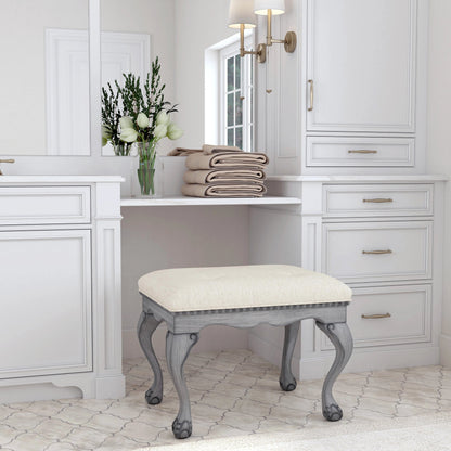 Ashford Upholstered Vanity Stool by Butler Specialty Company in ivory and powder gray. Made from rubberwood solids, mdf, resin, urethane foam, cotton in a traditional style.