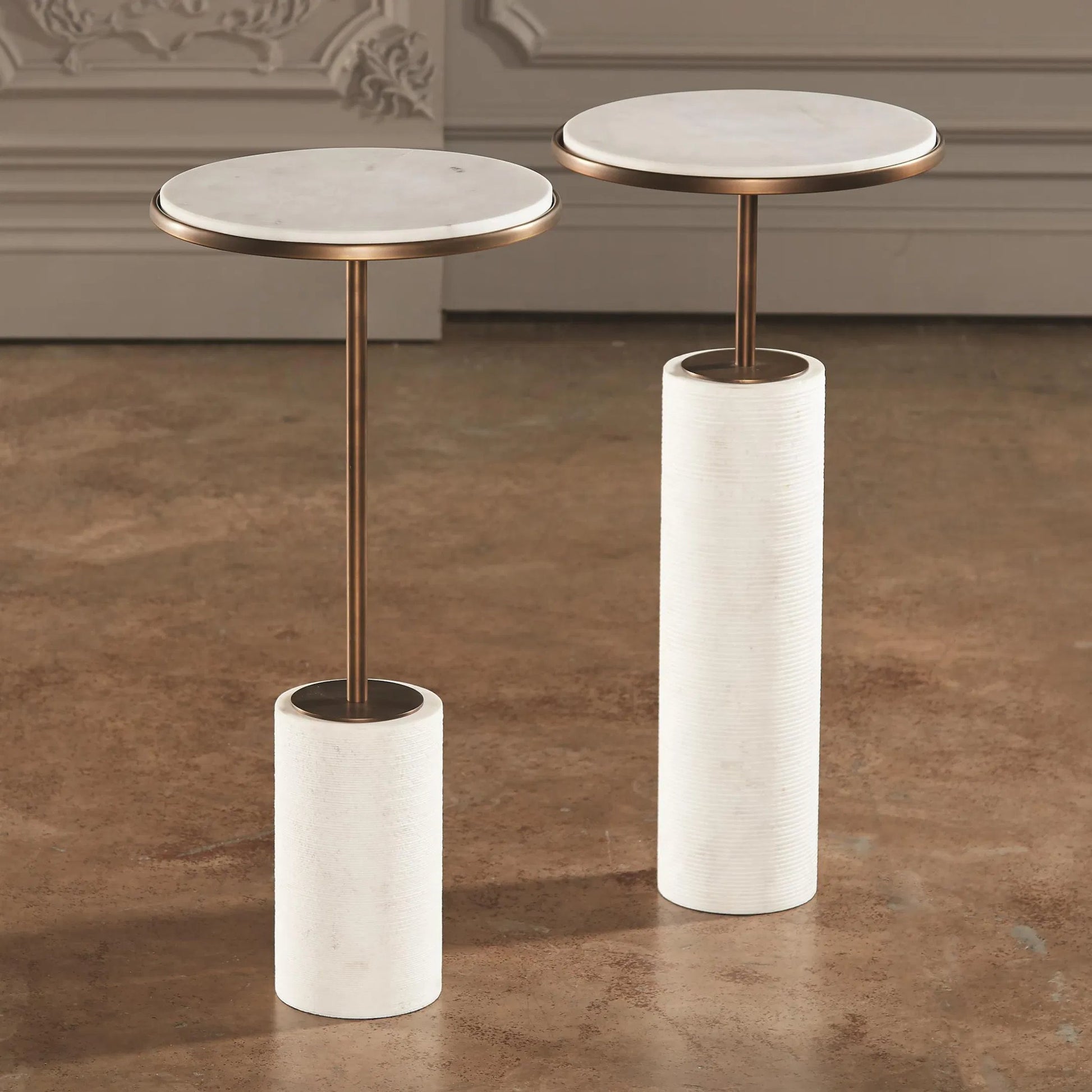 Tall Cored Marble Table by Global Views. Made from brass, marble in a transitional style.