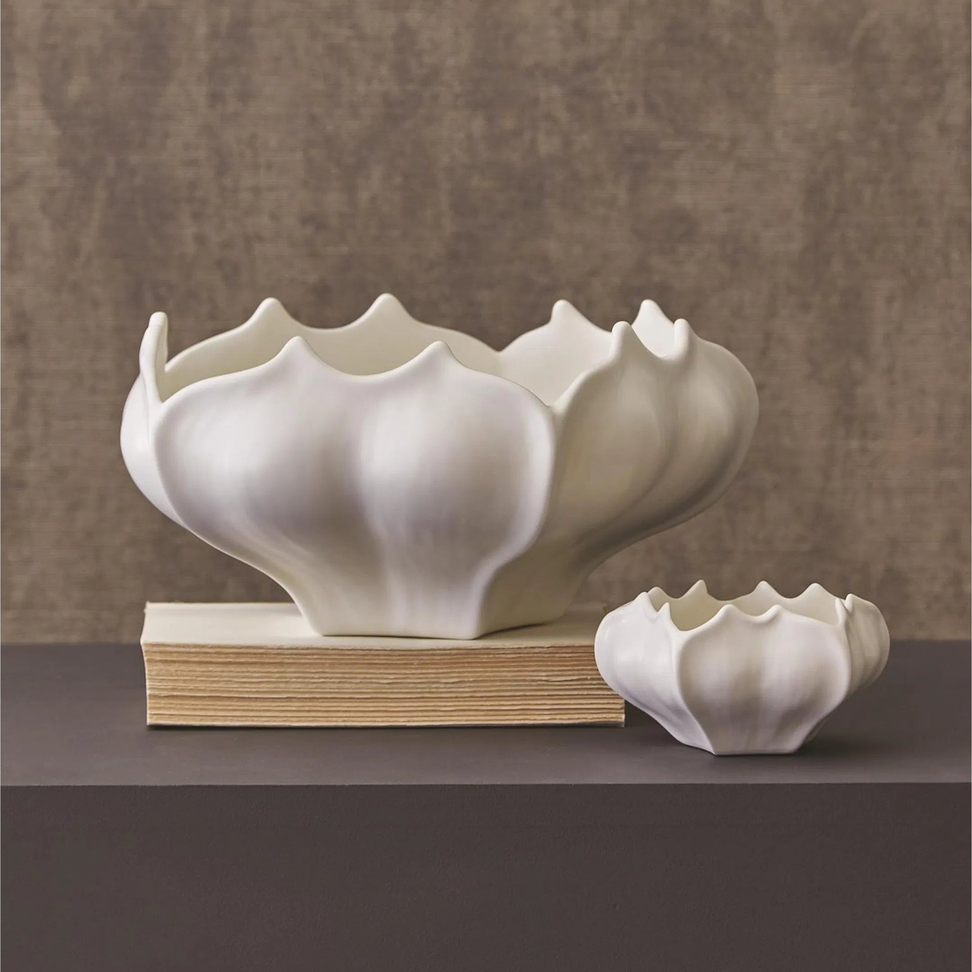 Star Fruit Bowl by Global Views. Made from ceramic in a coastal style.