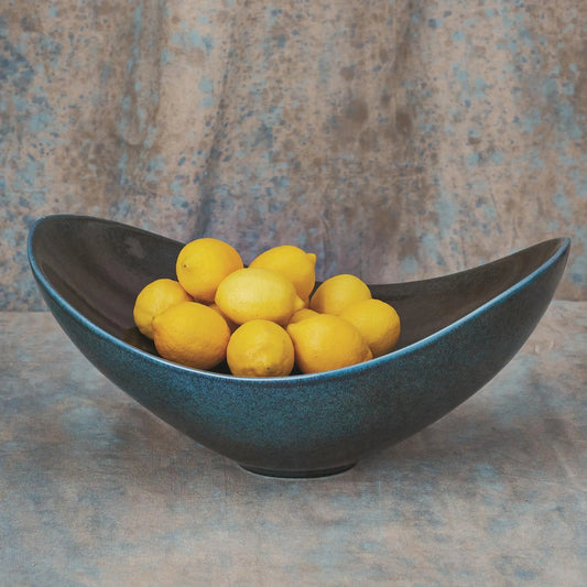 Swoop Bowl by Global Views. Made from ceramic in a modern style.