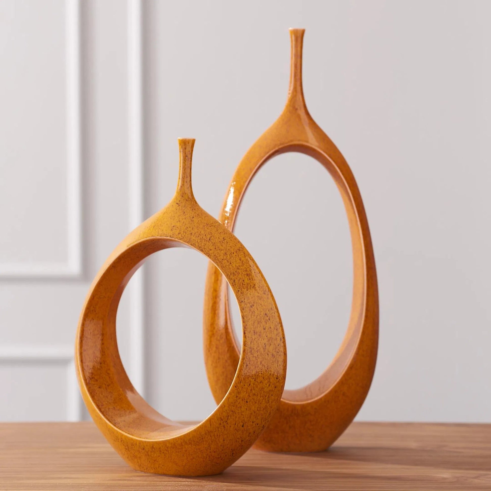 Open Ring Vase by Global Views. Made from ceramic in a eclectic & global style.