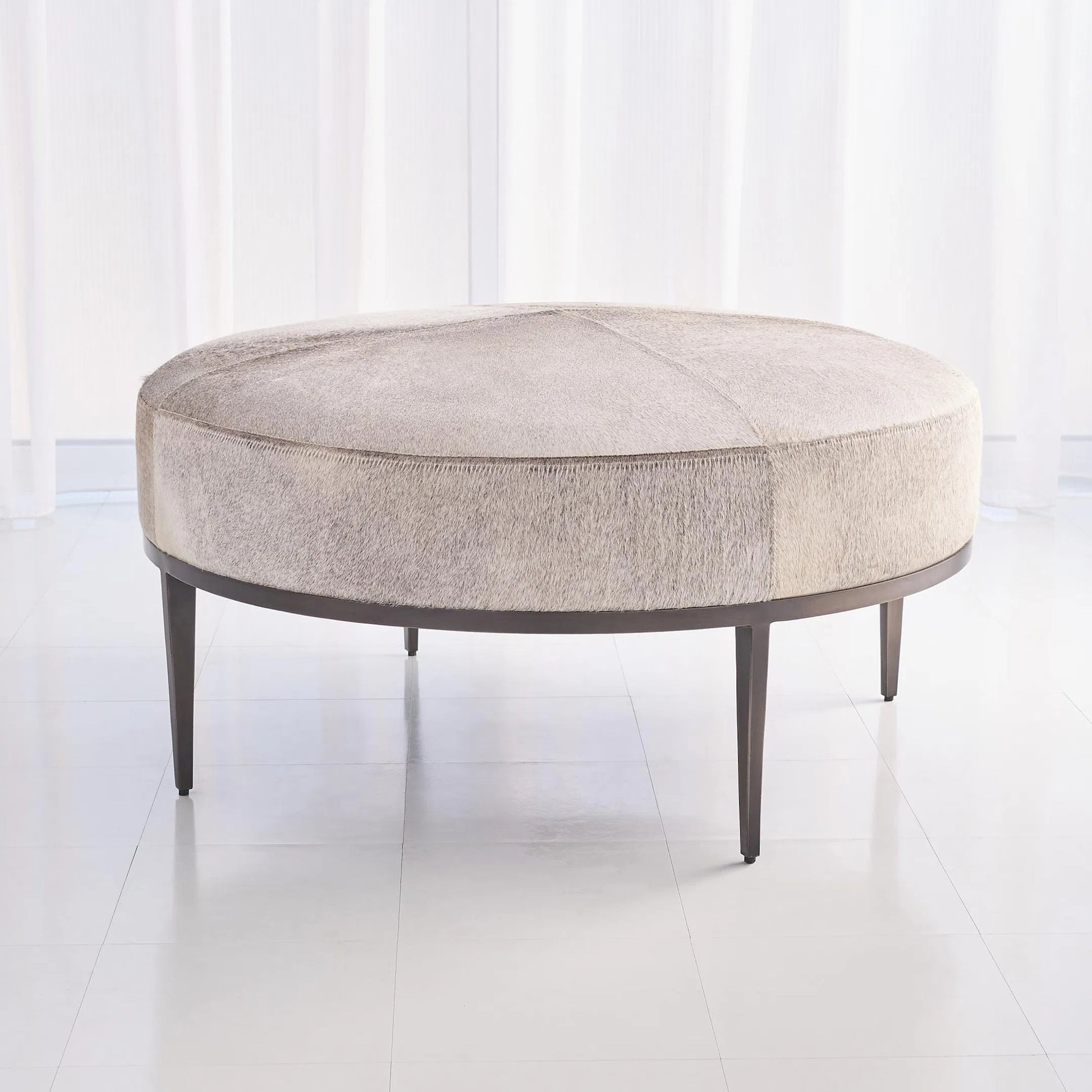 Urban Ottoman with Hair-On-Hide by Global Views. Made from mango, plyboard, iron in a transitional style.