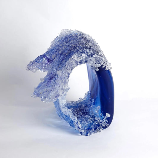Tidal Wave Sculpture by Global Views. Made from art glass in a coastal style.