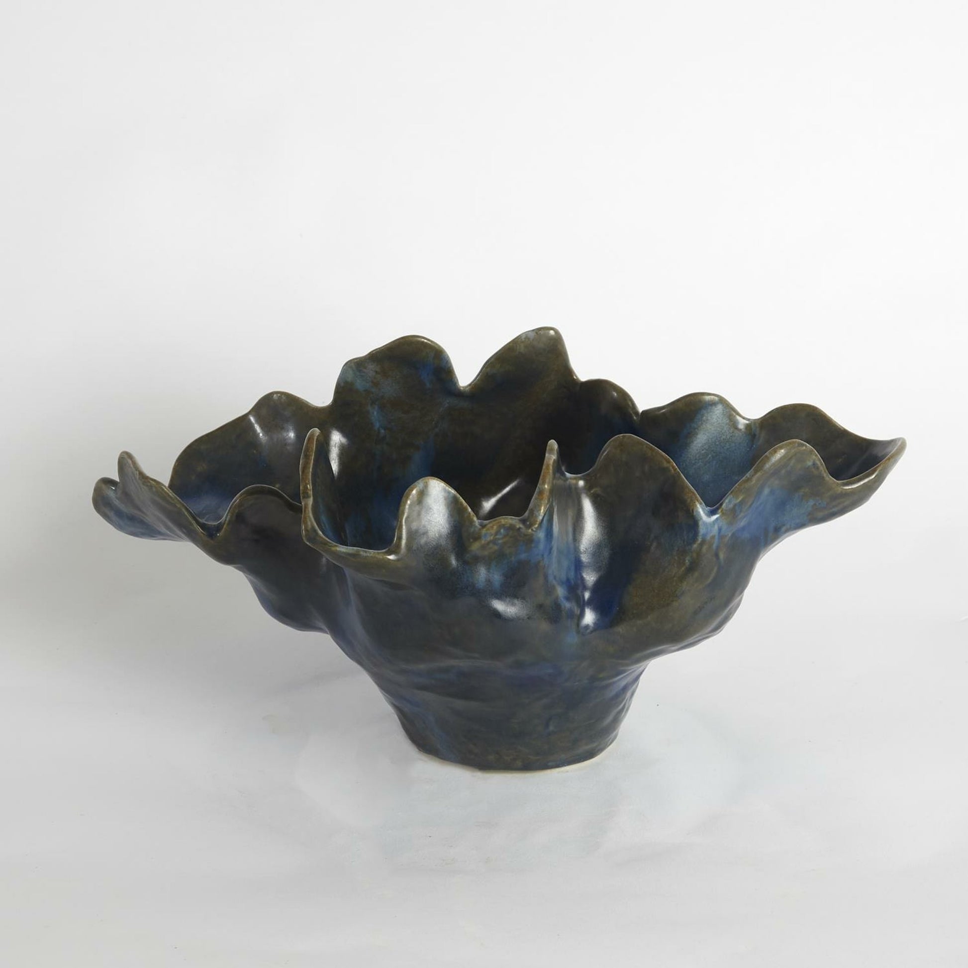 Meteor Bowl by Global Views. Made from ceramic in a coastal style.