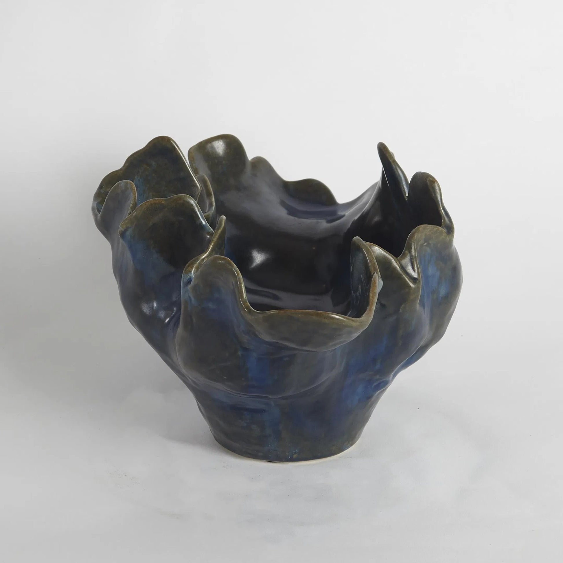 Meteor Bowl by Global Views. Made from ceramic in a coastal style.
