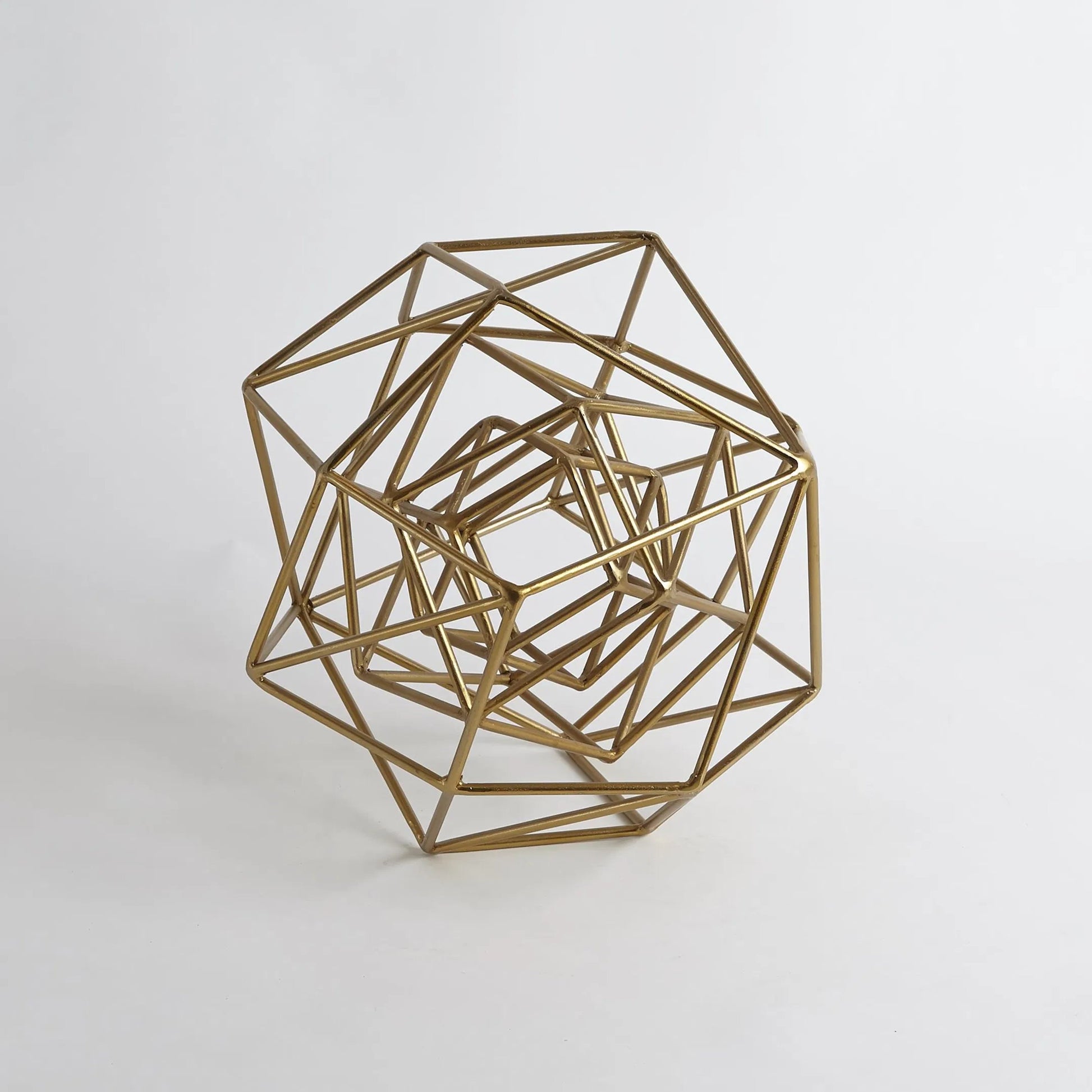 Geo Sculpture by Global Views in gold. Made from iron in a modern style.