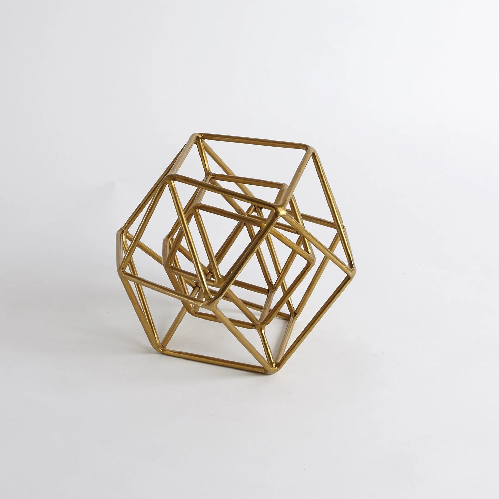 Geo Sculpture by Global Views in gold. Made from iron in a modern style.