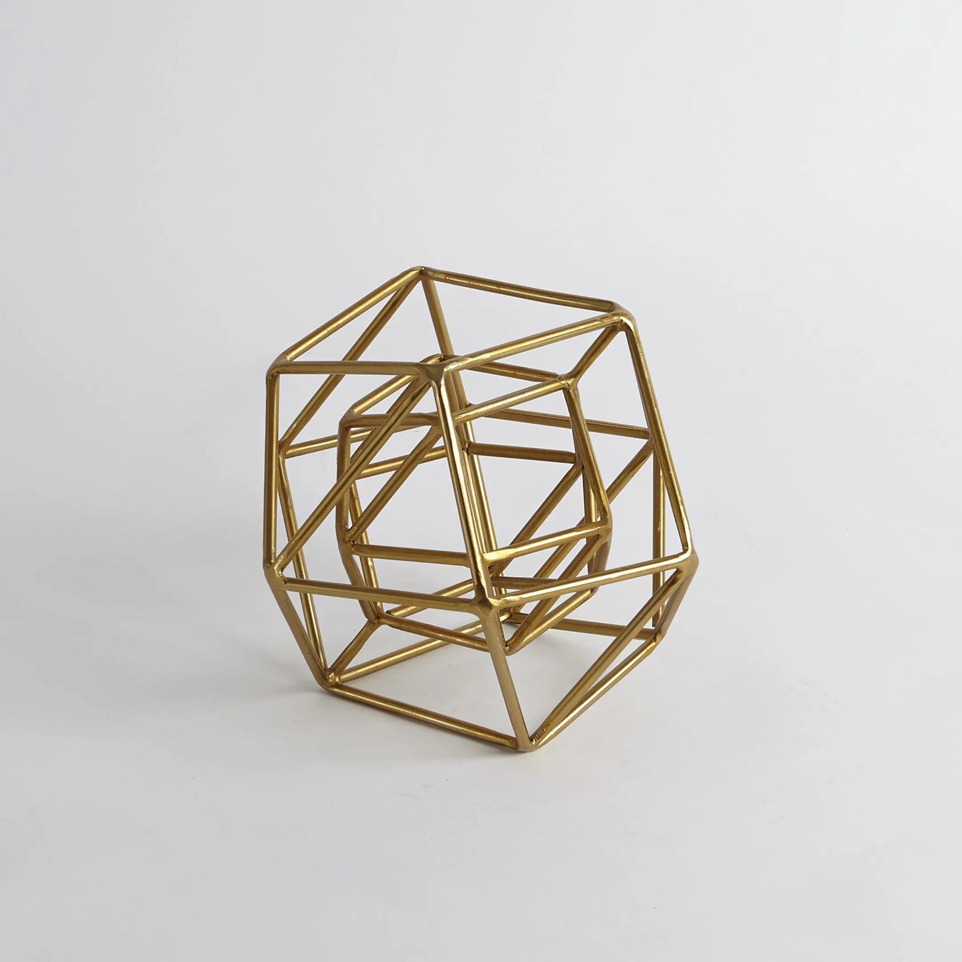Geo Sculpture by Global Views in gold. Made from iron in a modern style.