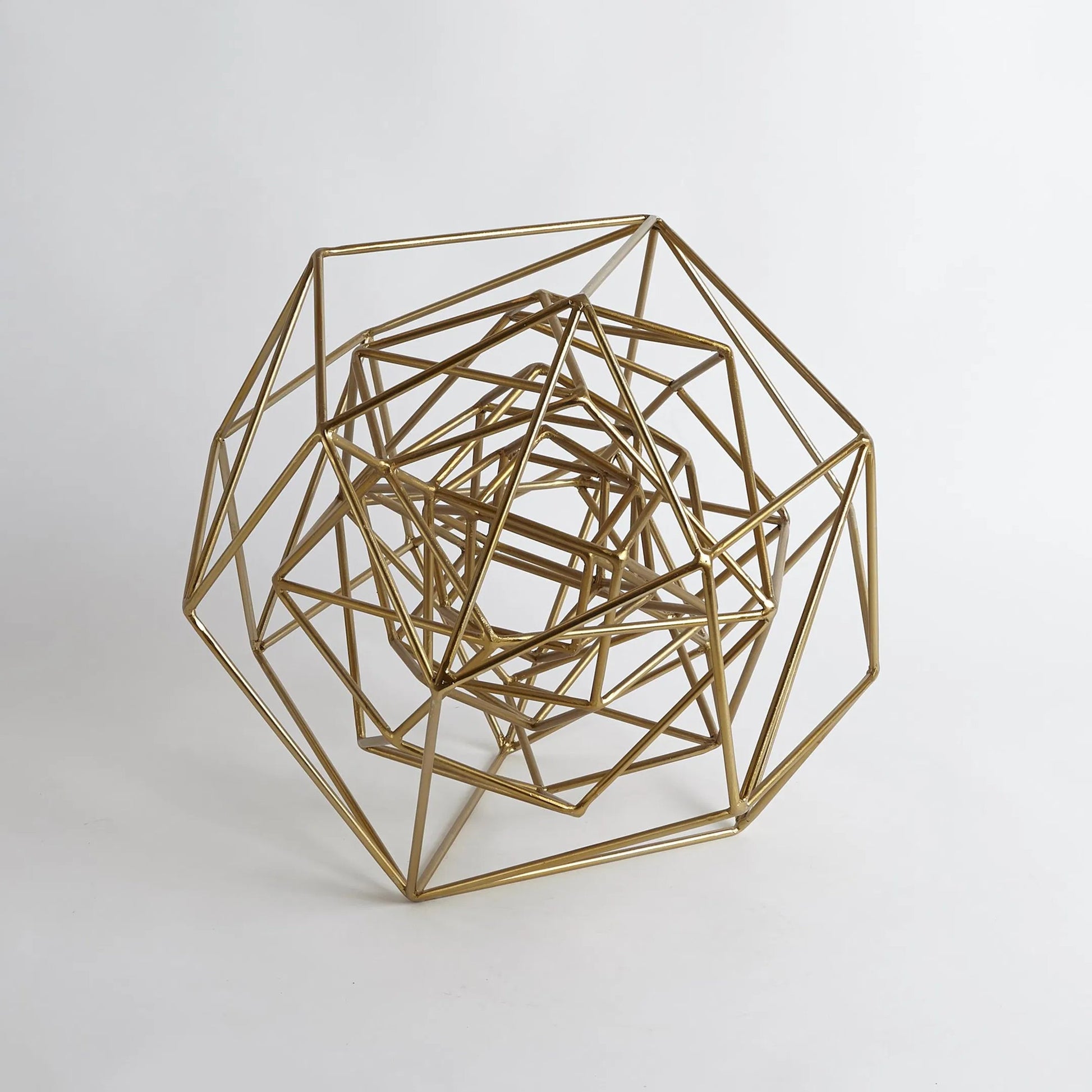 Geo Sculpture by Global Views in gold. Made from iron in a modern style.