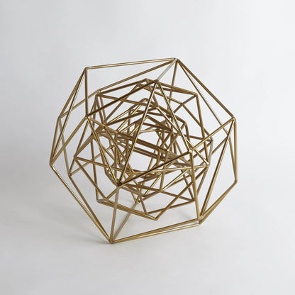 Geo Sculpture by Global Views in gold. Made from iron in a modern style.