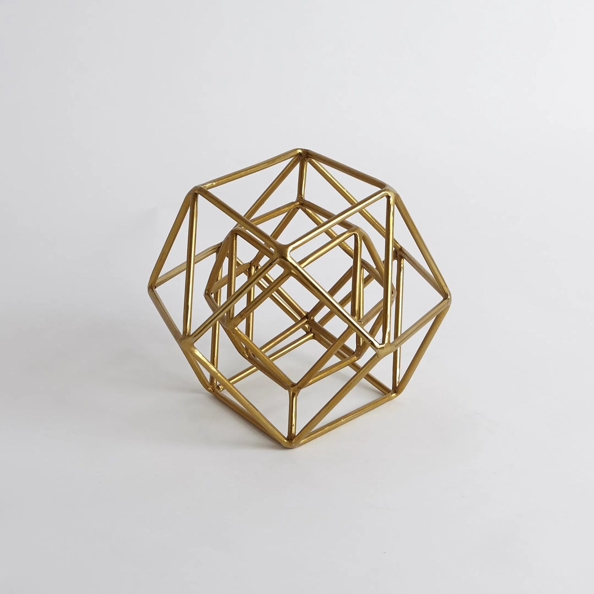 Geo Sculpture by Global Views in gold. Made from iron in a modern style.