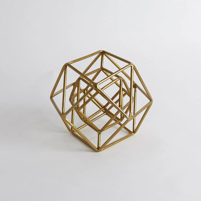Geo Sculpture by Global Views in gold. Made from iron in a modern style.