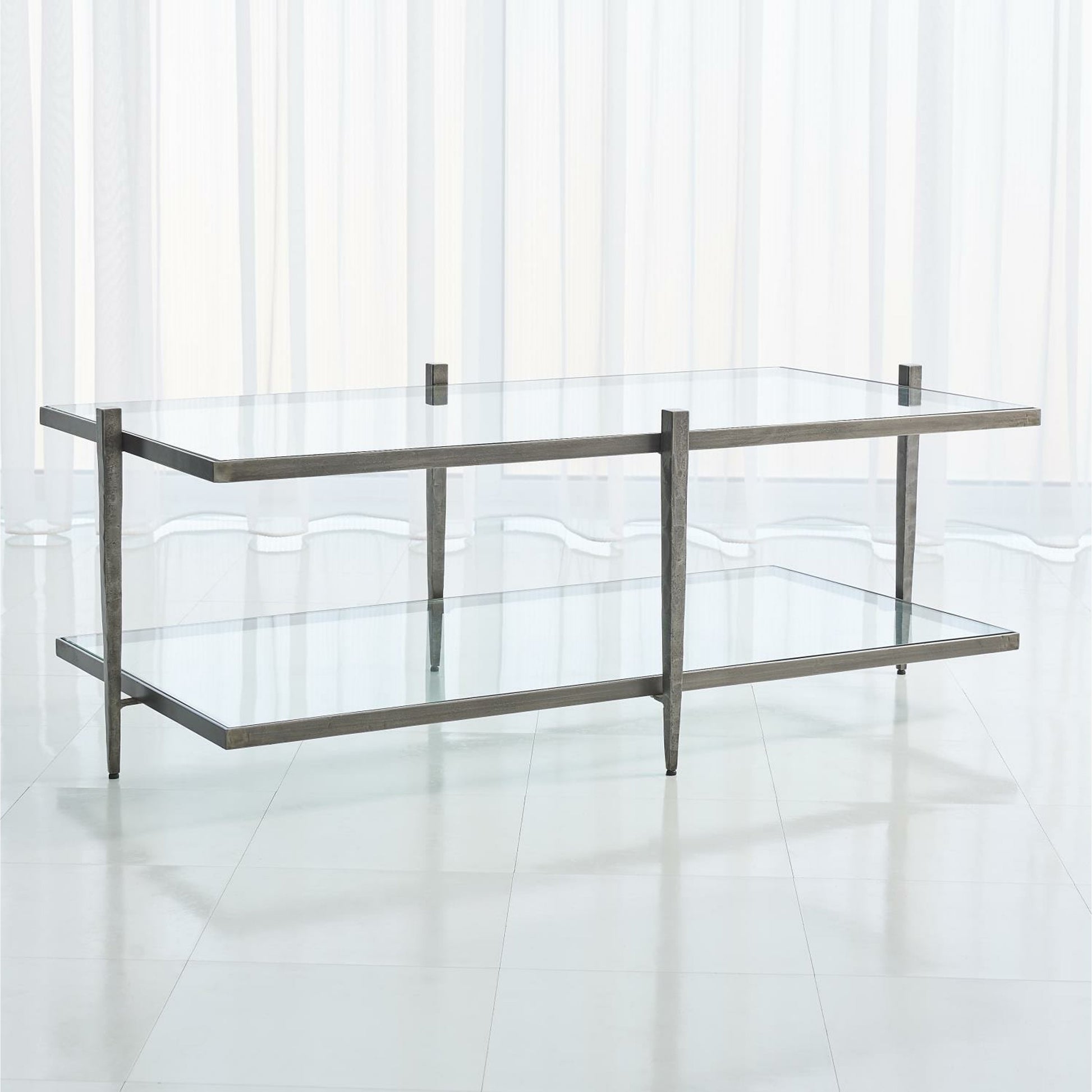 Laforge Cocktail Table by Global Views. Made from iron, tempered glass in a transitional style.