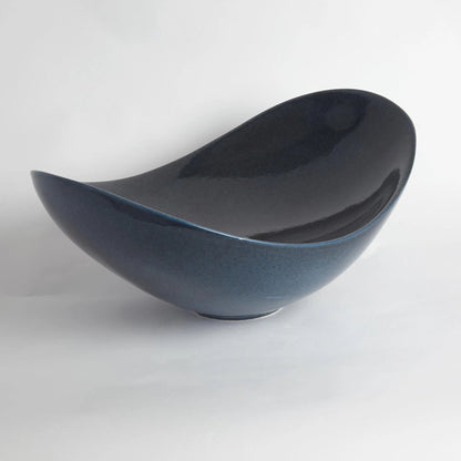 Swoop Bowl by Global Views. Made from ceramic in a modern style.