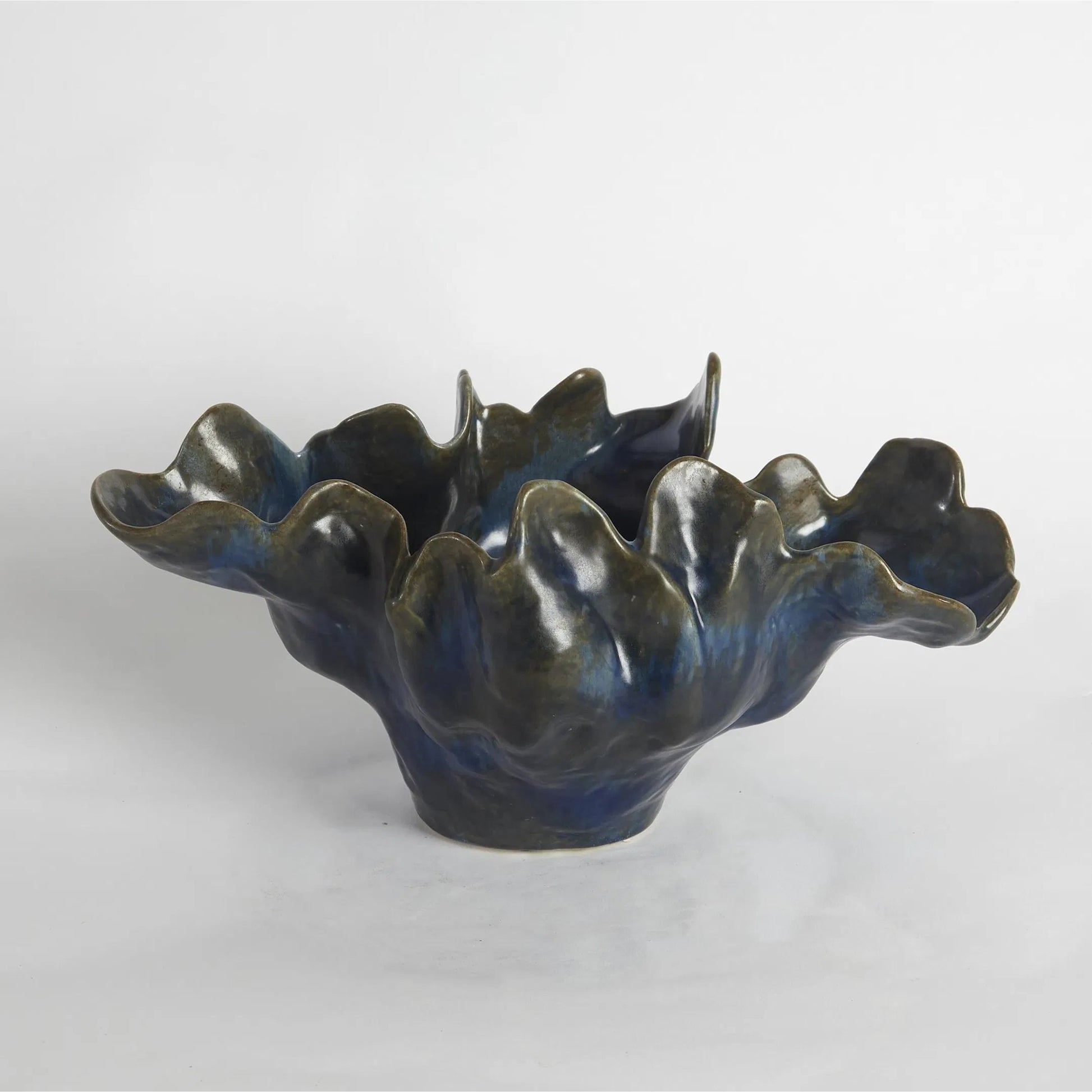 Meteor Bowl by Global Views. Made from ceramic in a coastal style.