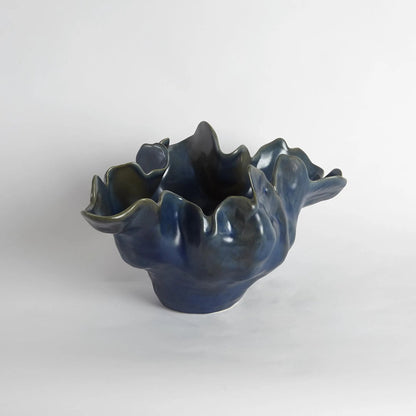 Meteor Bowl by Global Views. Made from ceramic in a coastal style.
