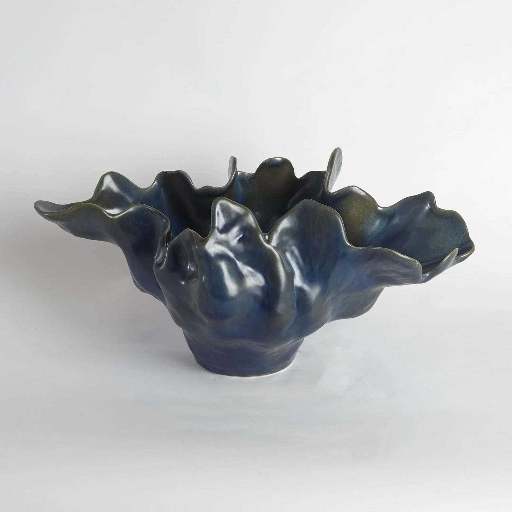 Meteor Bowl by Global Views. Made from ceramic in a coastal style.
