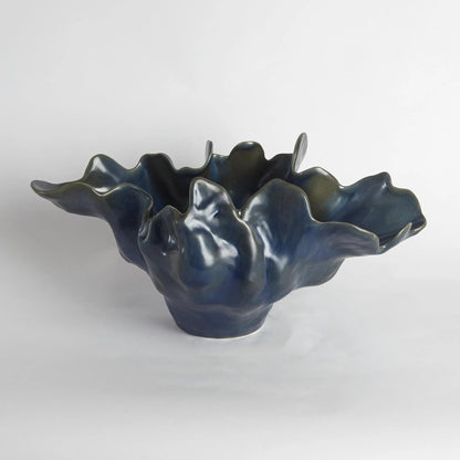 Meteor Bowl by Global Views. Made from ceramic in a coastal style.