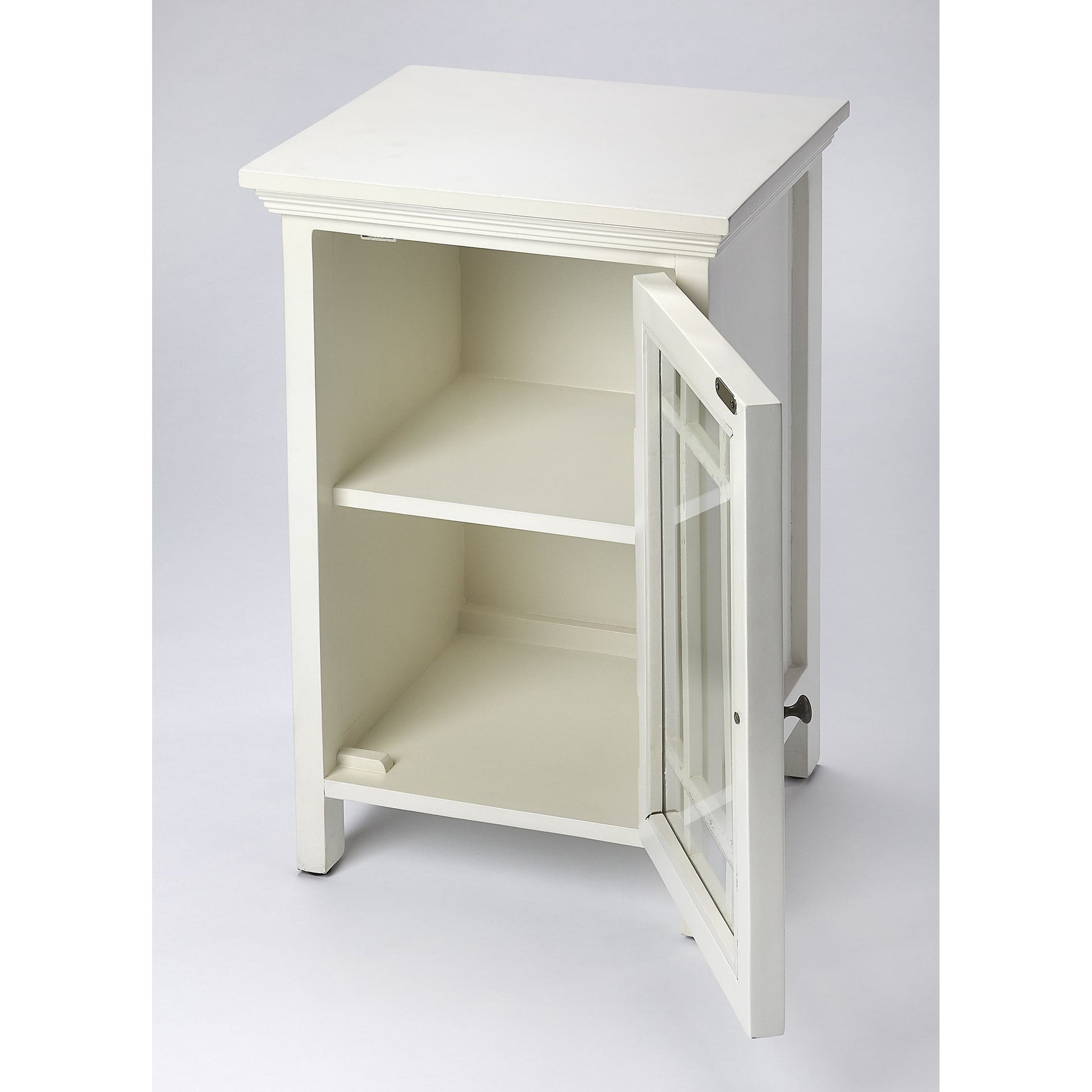 Baxter Chairside Chest by Butler Specialty Company in white and glossy white. Made from mango wood solids, mdf, clear glass, iron, antique finish in a cottage & farmhouse style.