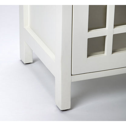 Baxter Chairside Chest by Butler Specialty Company in white and glossy white. Made from mango wood solids, mdf, clear glass, iron, antique finish in a cottage & farmhouse style.