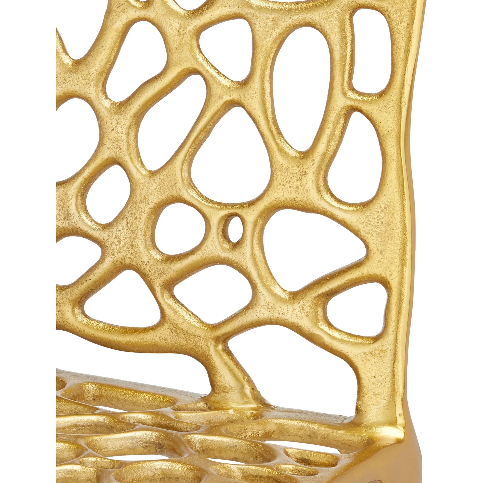 Honeycomb Side Chair by Currey and Company in gold. Made from cast aluminum in a modern style.