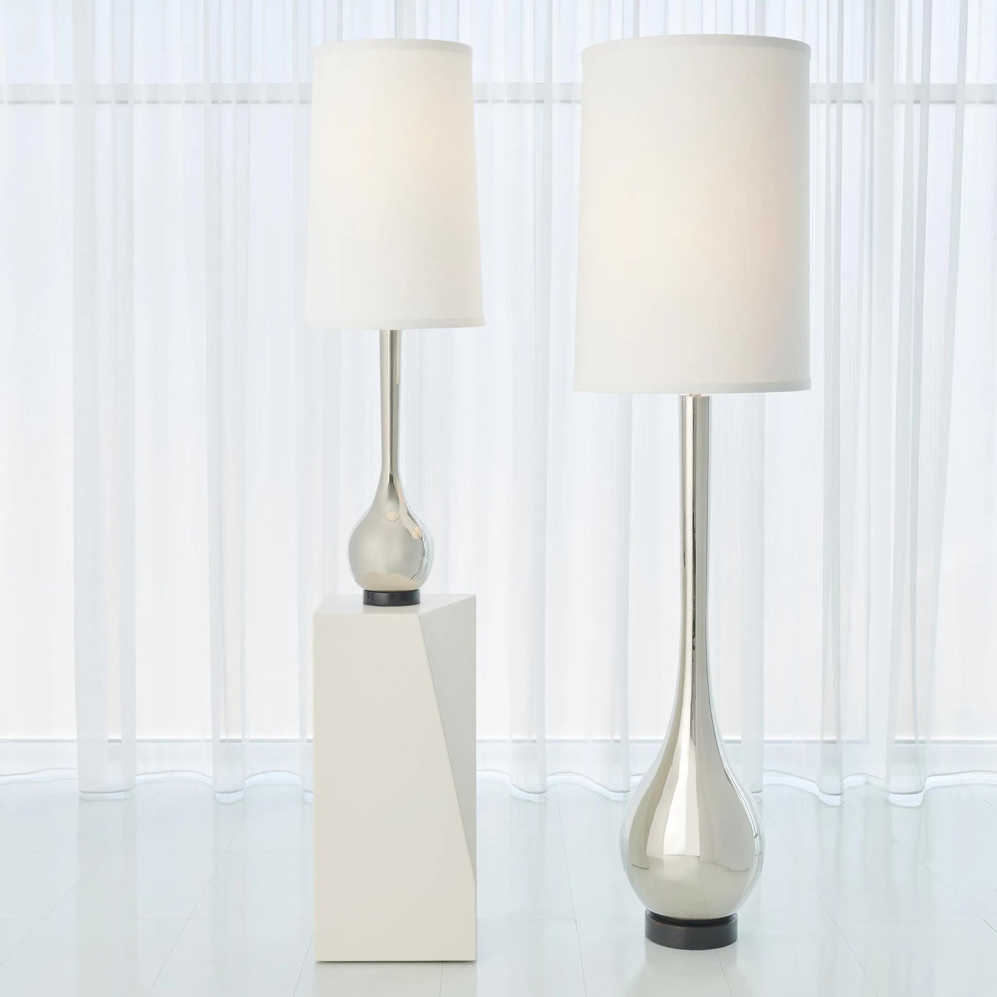 Bulb Vase Table Lamp by Global Views. Made from brass, black lime stone in a transitional style.