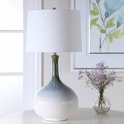Eichler Mid-Century Table Lamp by Uttermost. Made from ceramic, fabric, iron in a coastal style.