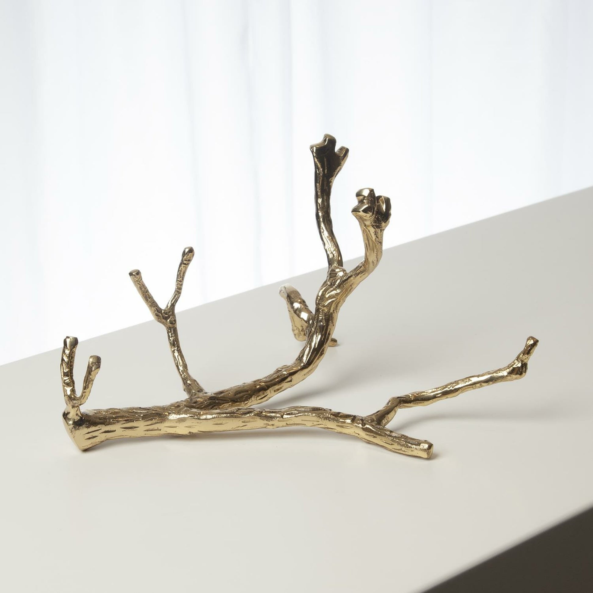 Twig Wine Bottle Holder by Global Views. Made from cast brass in a eclectic & global style.