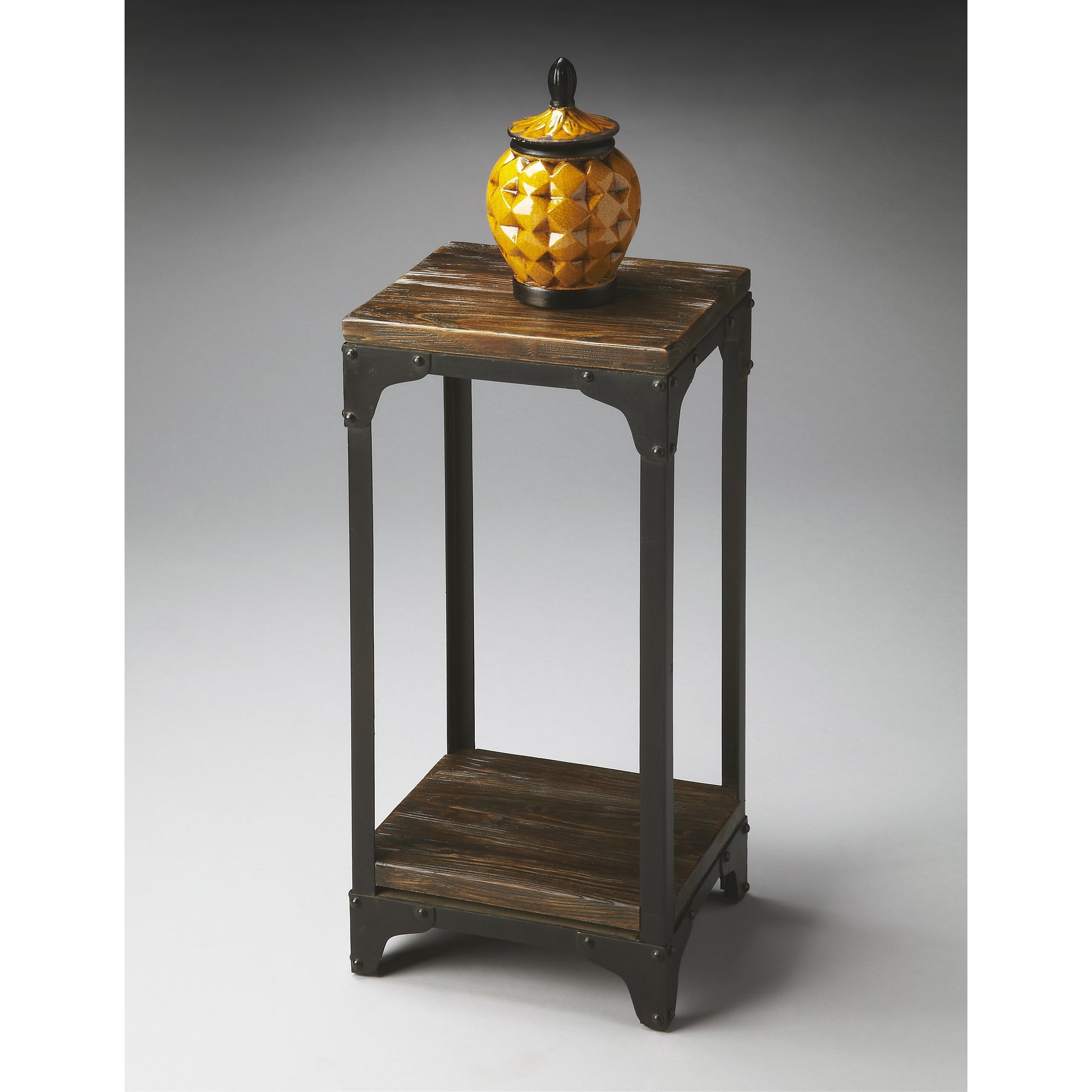 Gandolph Industrial Chic Pedestal Stand by Butler Specialty Company in multi-color and mountain lodge. Made from iron, mango wood solids in a modern style.