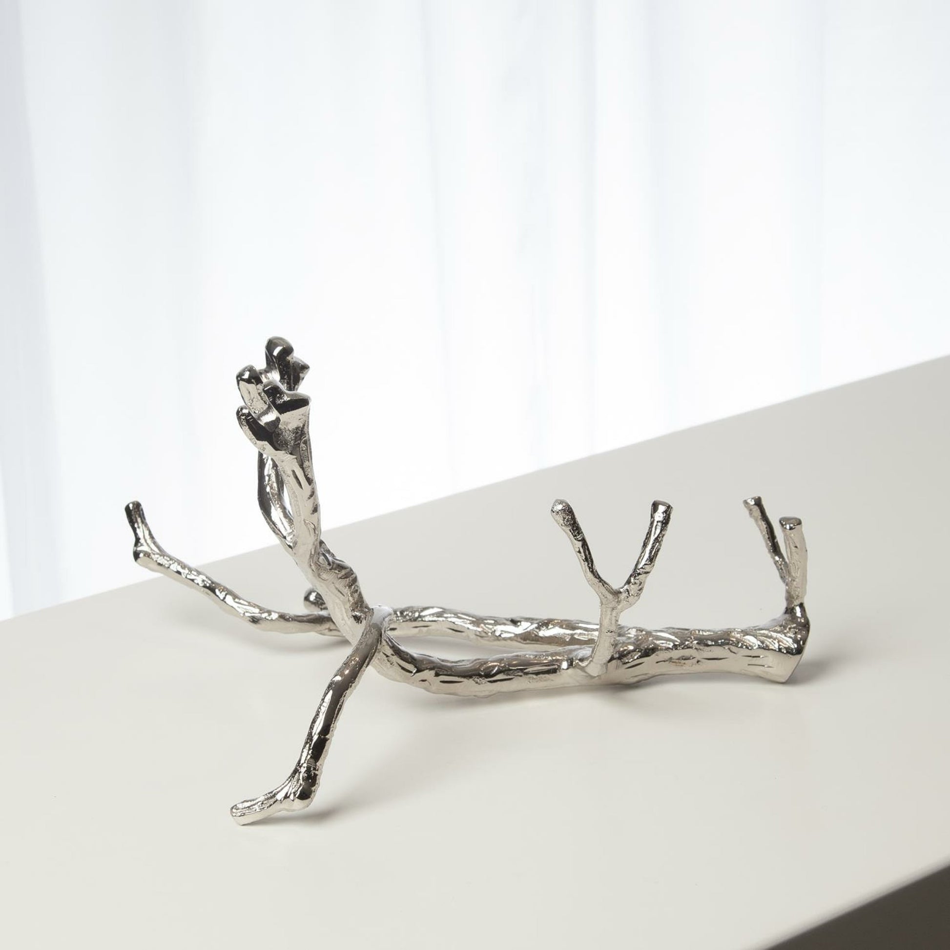 Twig Wine Bottle Holder by Global Views. Made from cast brass in a eclectic & global style.