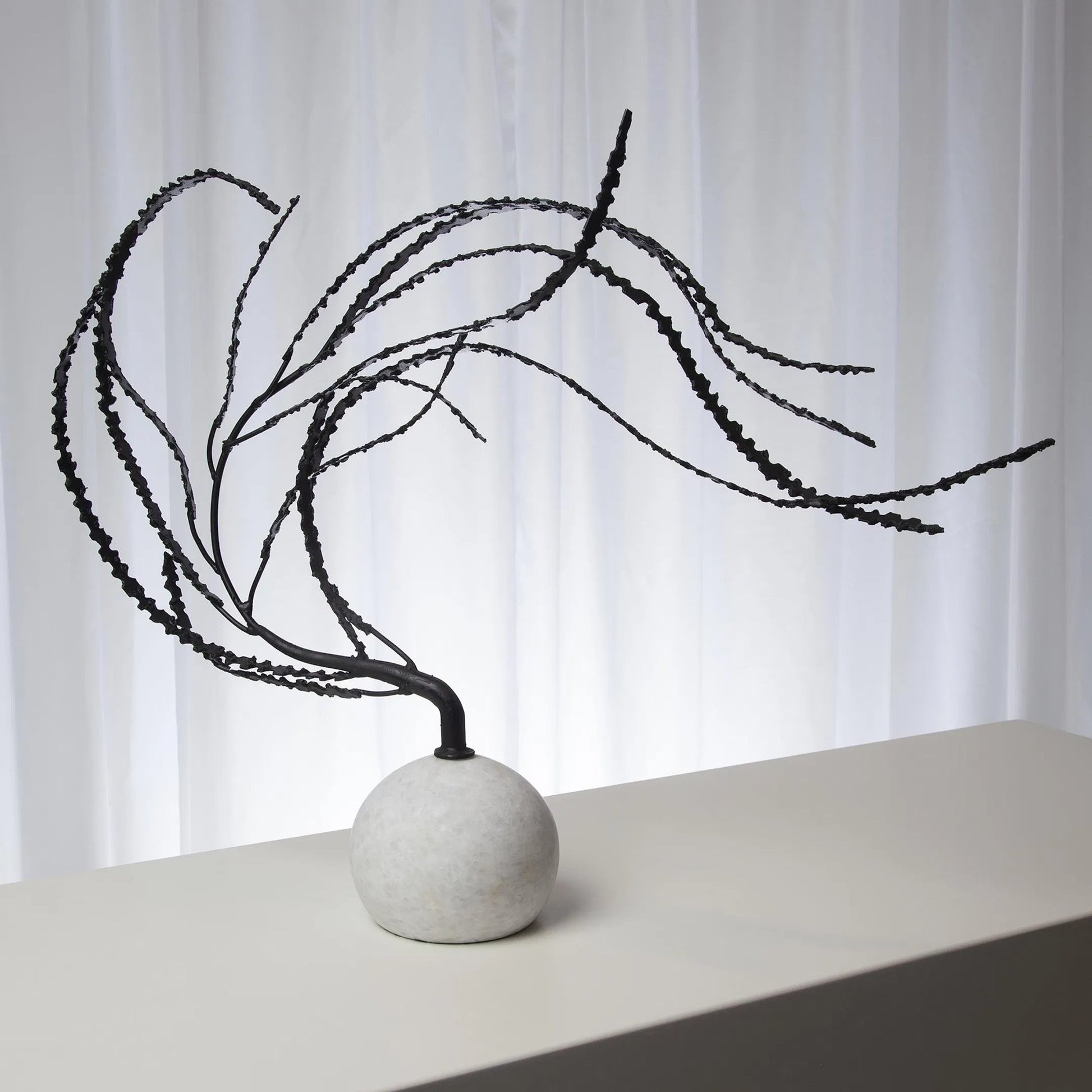 Thistle Sculpture by Global Views in black. Made from iron, white marble in a eclectic & global style.