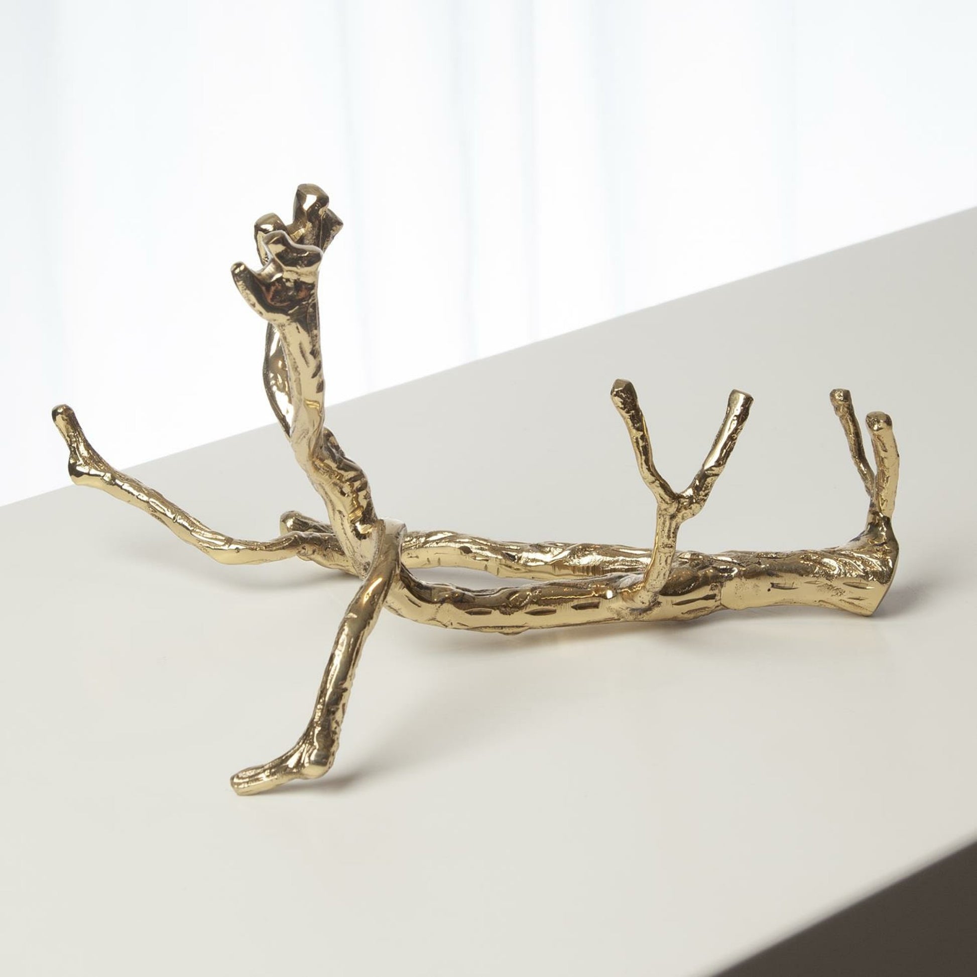 Twig Wine Bottle Holder by Global Views. Made from cast brass in a eclectic & global style.