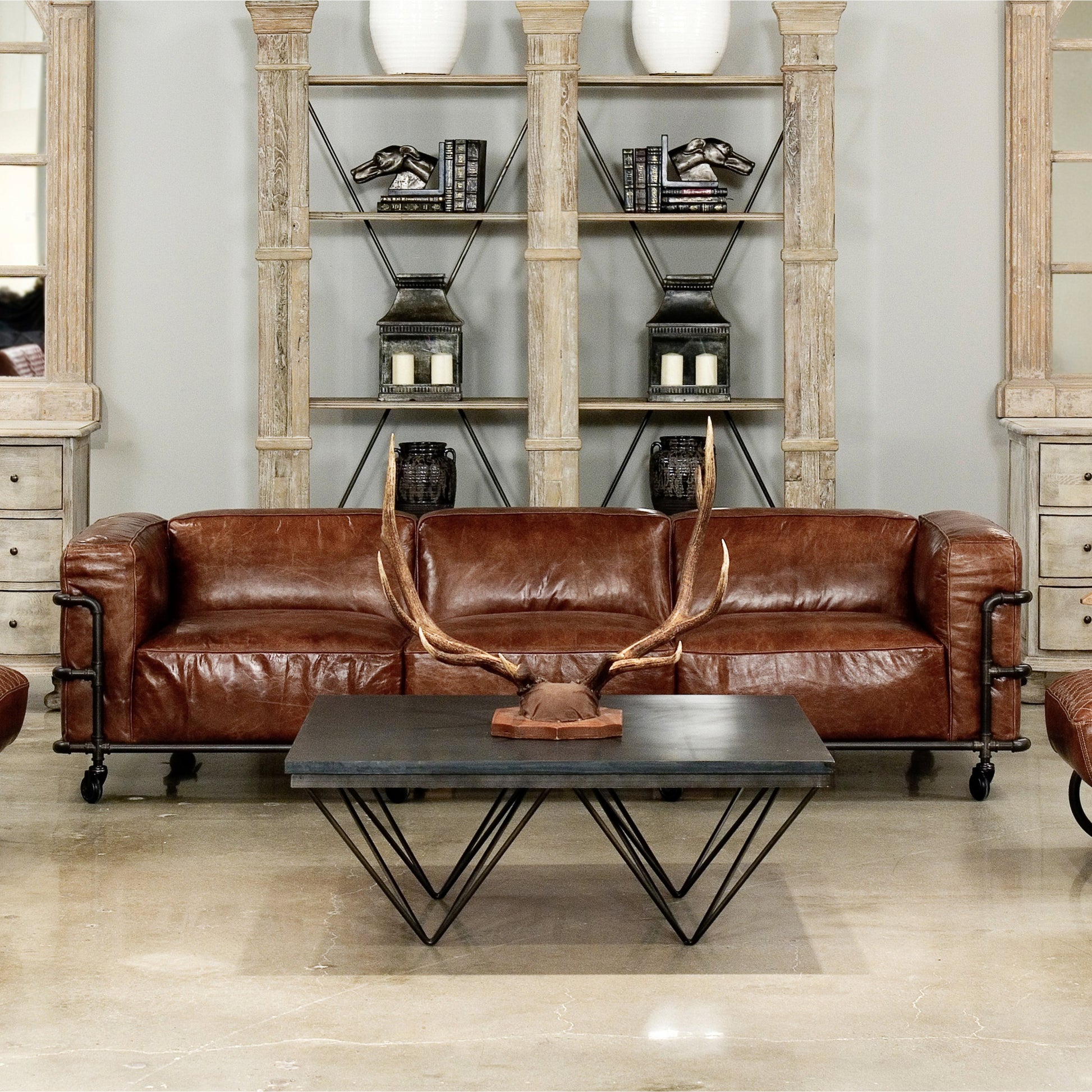 Antwerp Couch by Sarreid Ltd. in brown and cuba brown leather. Made from leather, iron in a modern style.