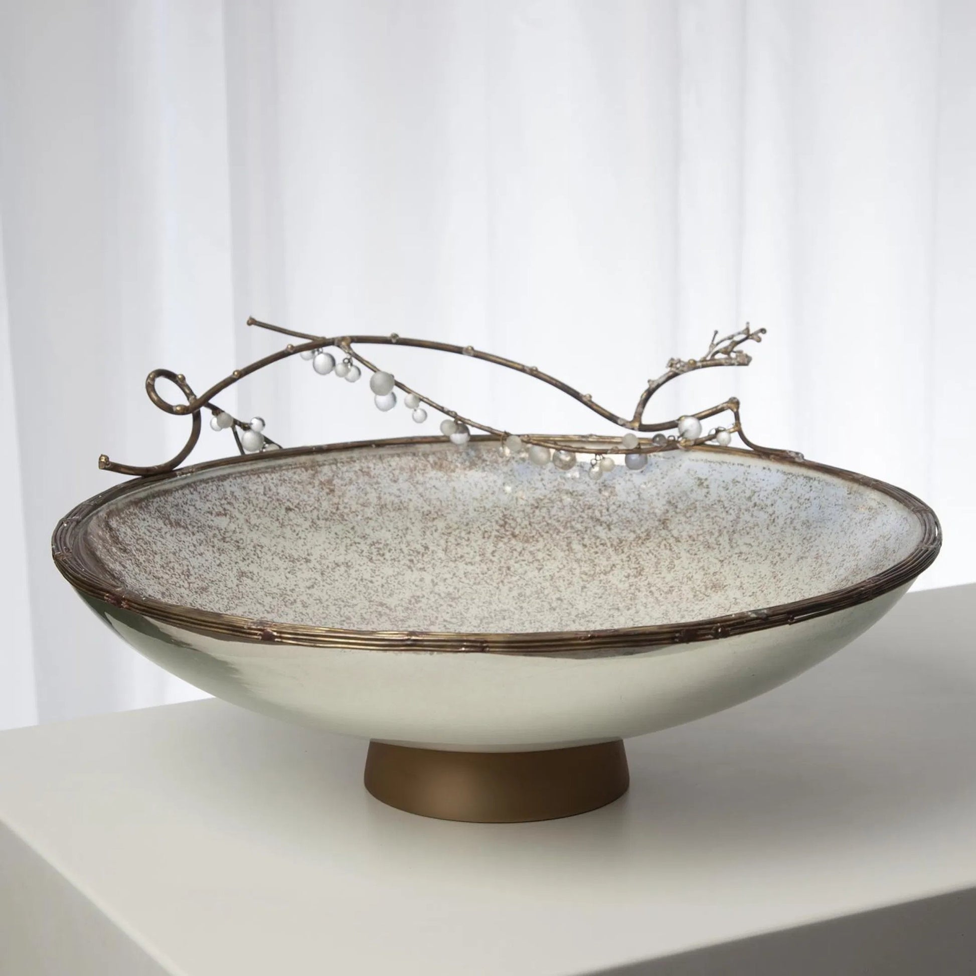 Foret Centerpiece by Global Views in matte antique brass. Made from snow white finished glass, aluminum, brass, glass beads in a modern style.