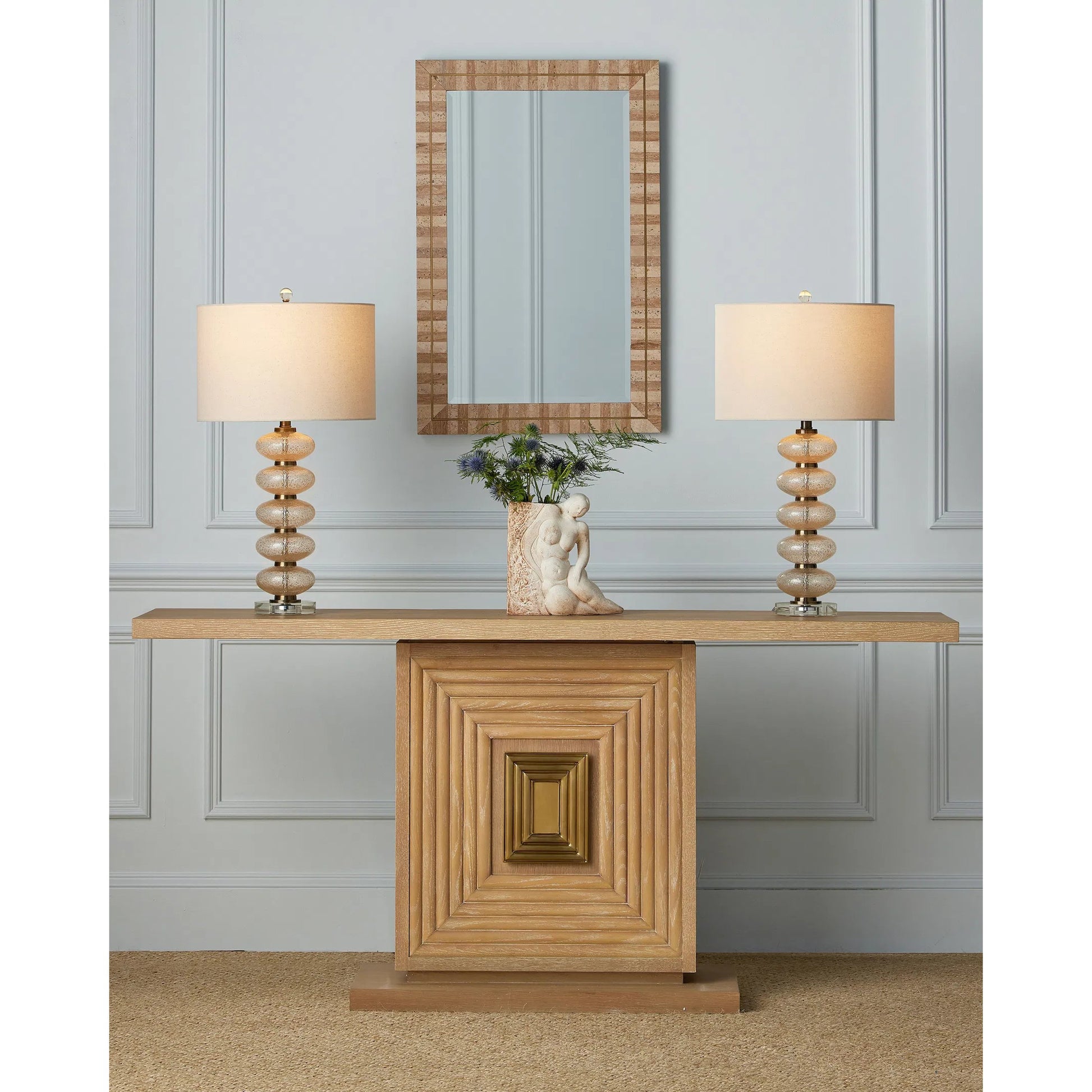 Morombe Console Table by Currey and Company in washed oak. Made from red oak, white oak veneer, brass in a transitional style.
