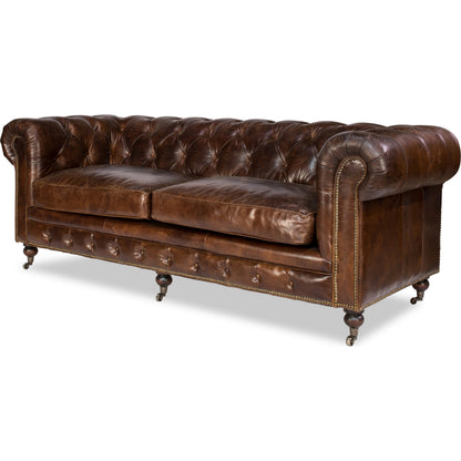 Castered Chesterfield Sofa by Sarreid Ltd. in vintage havana. Made from wood, leather in a traditional style.