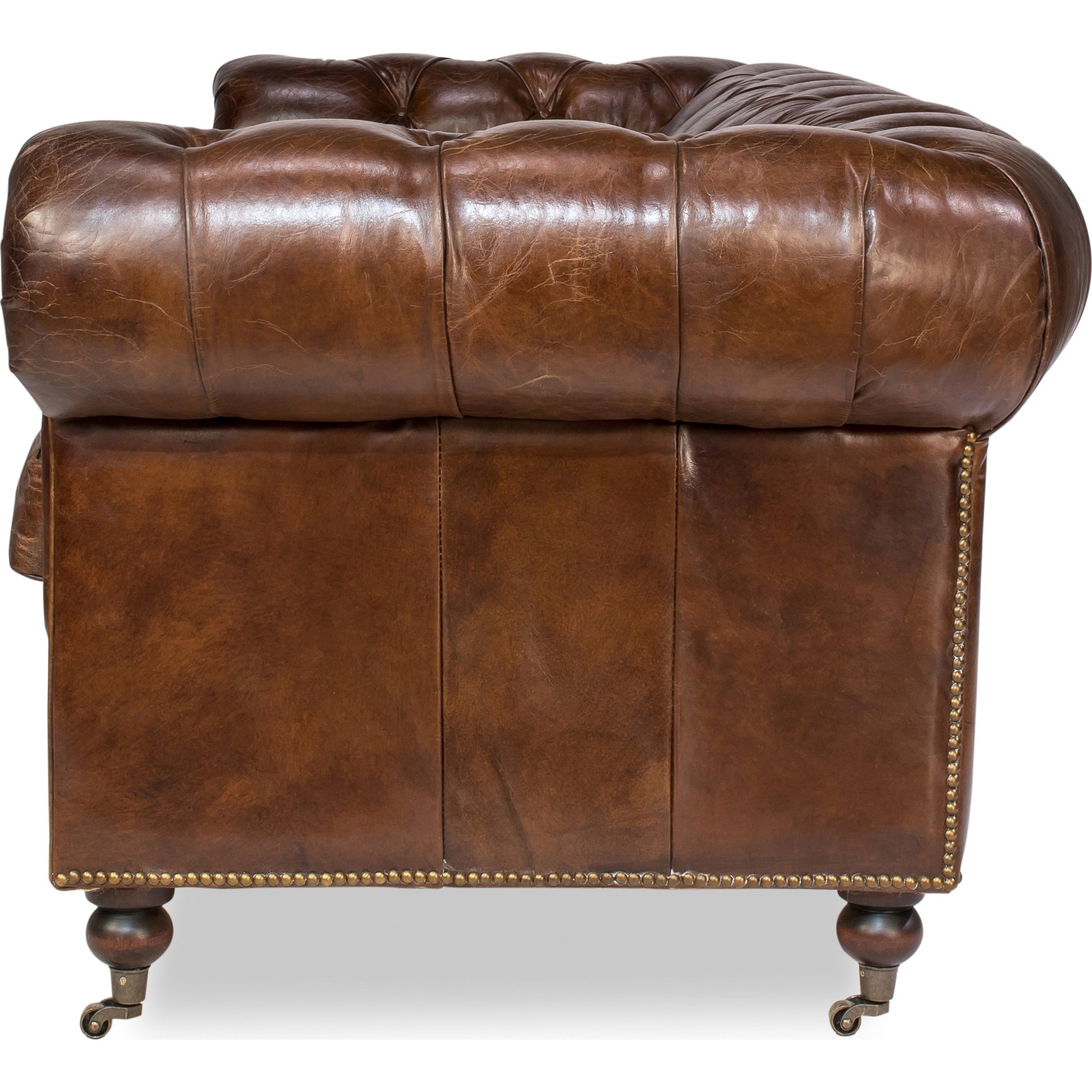 Castered Chesterfield Sofa by Sarreid Ltd. in vintage havana. Made from wood, leather in a traditional style.