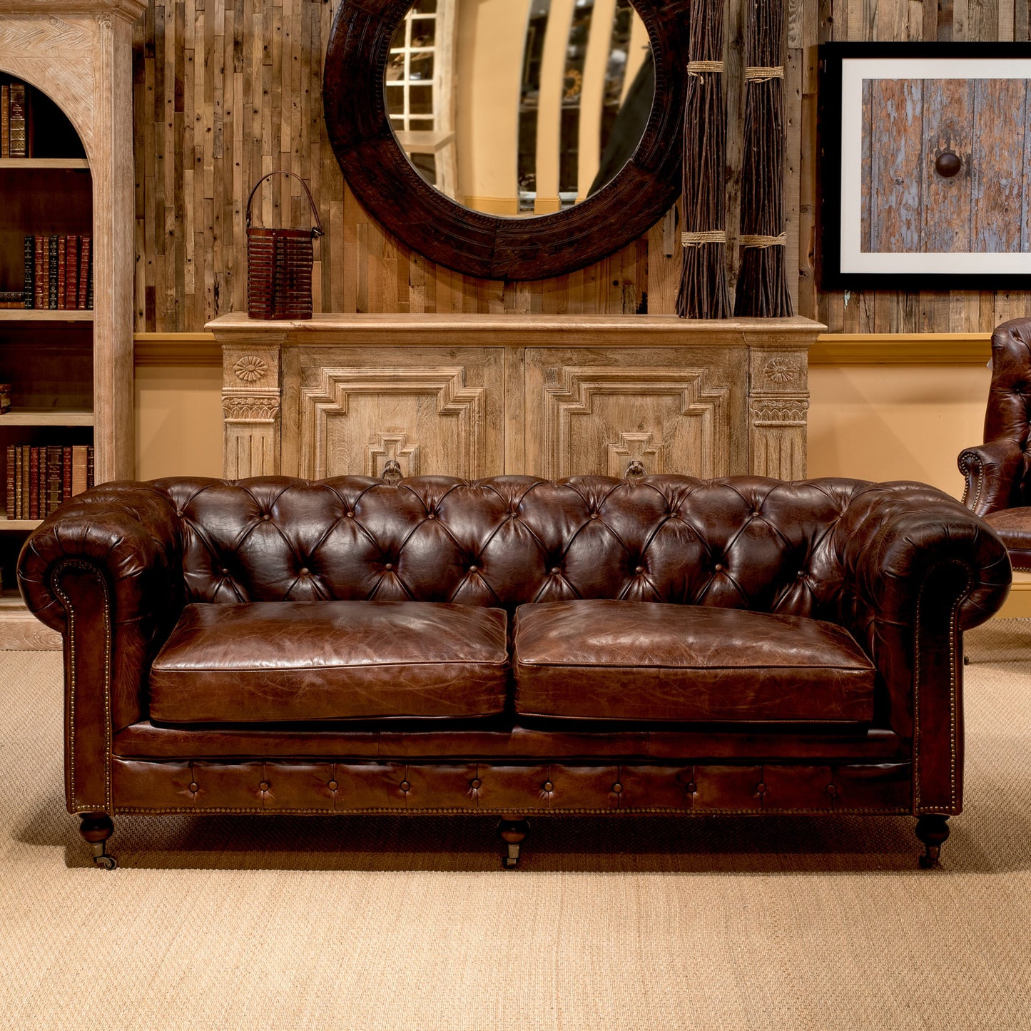 004 S-242946 | Lifestyle | Castered Chesterfield Sofa by Sarreid Ltd. in vintage havana. Made from wood, leather in a traditional style.