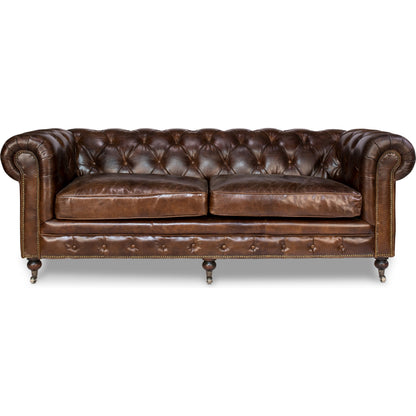 Castered Chesterfield Sofa by Sarreid Ltd. in vintage havana. Made from wood, leather in a traditional style.