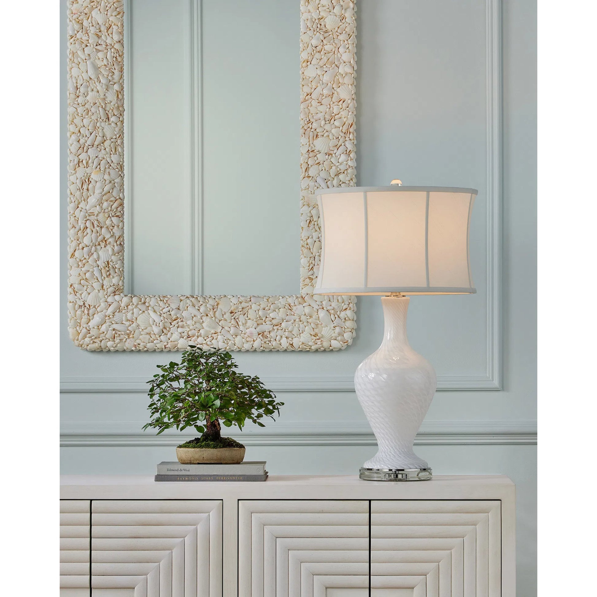 Morombe Cabinet by Currey and Company in cerused white. Made from white oak in a eclectic & global style.