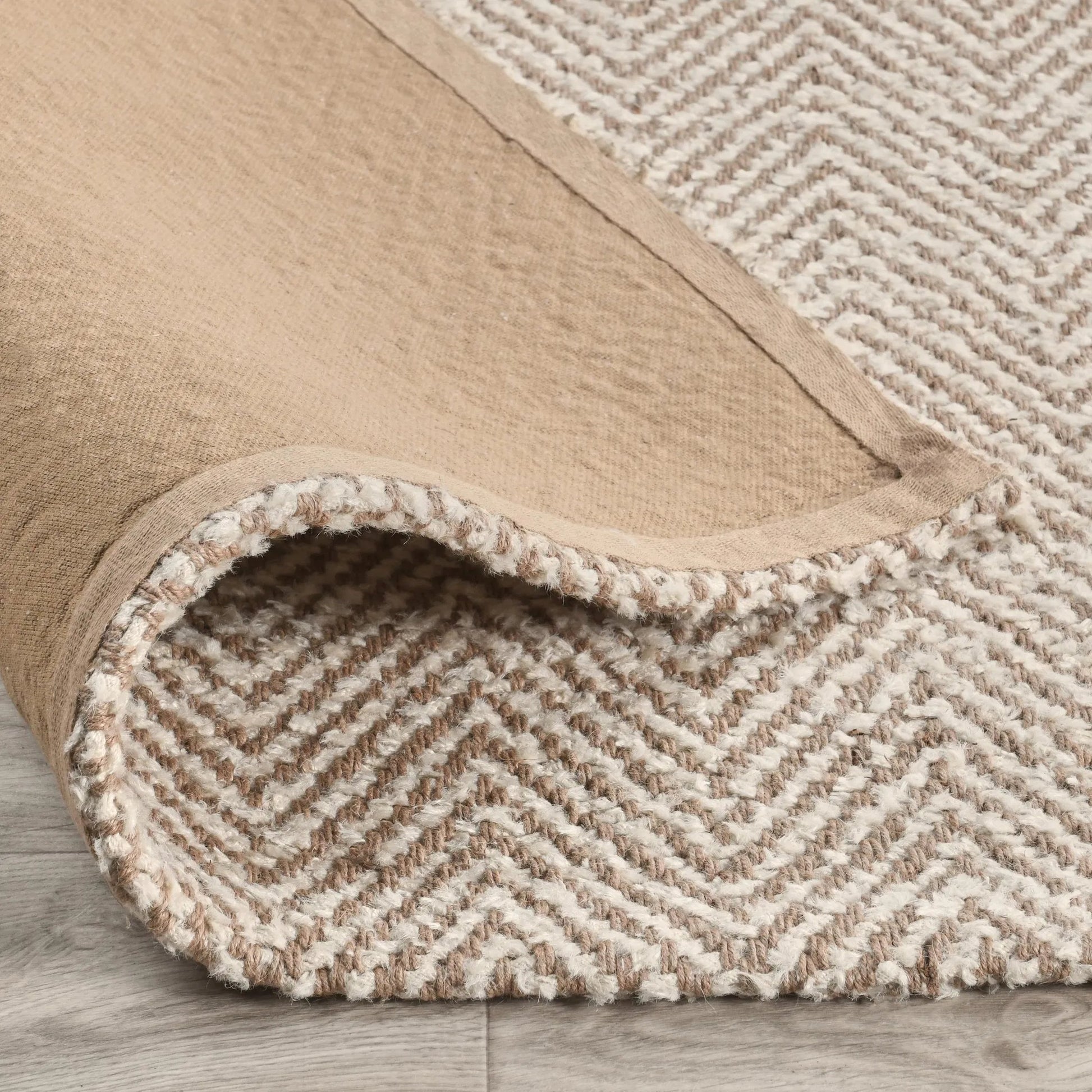 Herringbone Area Accent Rug by Villa by Classic Home in ivory. Made from 75% wool, 25% jute, cotton canvas backing for size 5x8, larger in a unique style.