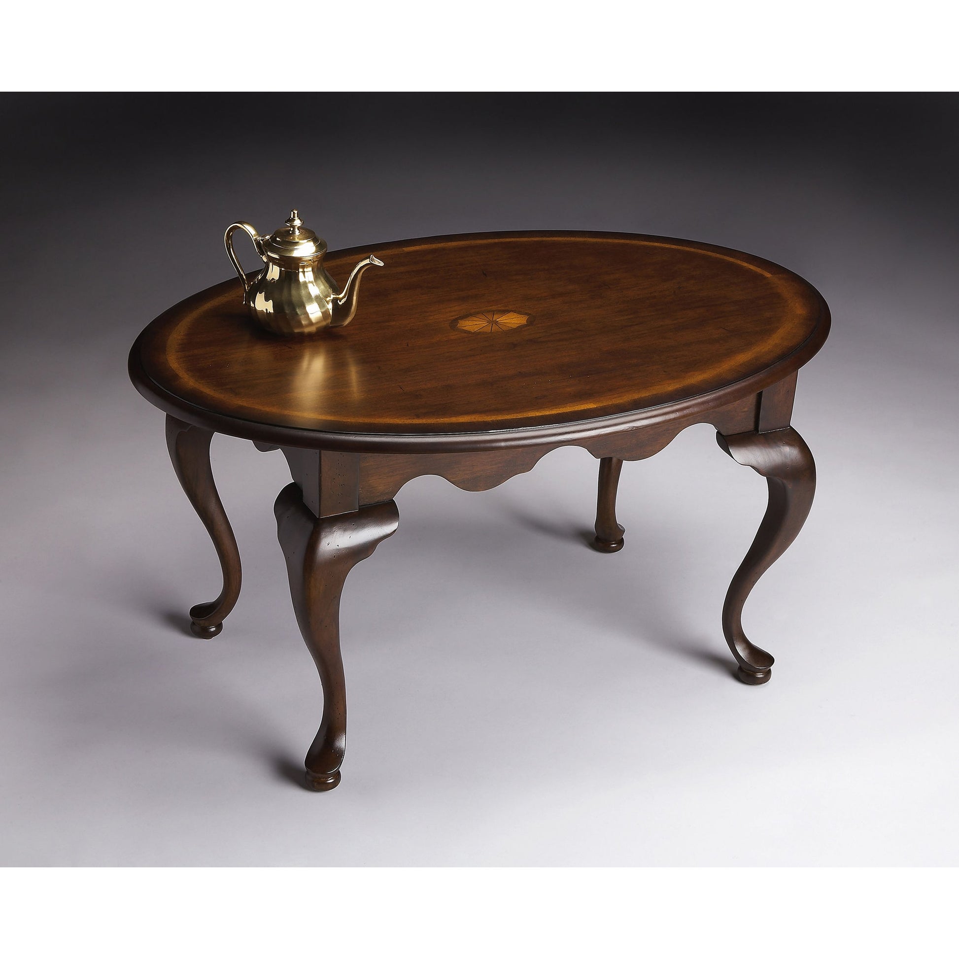 Grace Oval Cocktail Table by Butler Specialty Company. Made from rubberwood solids, mdf, cherry, maple, walnut veneers in a traditional style.